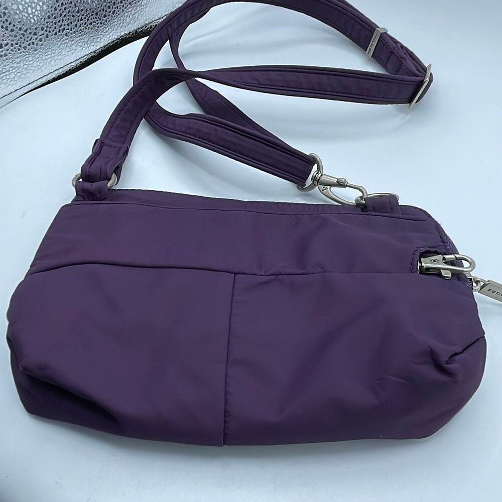 Travelon purple crossbody anti theft small handbag.
